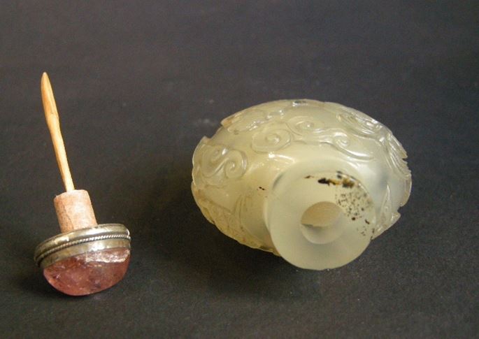 Agate snuff bottle sculpted with scholar and servant in landscape on a face, other with figure in a boat | MasterArt